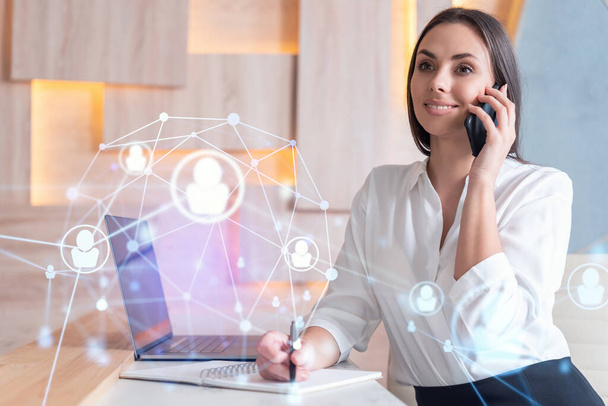 Attractive businesswoman in white shirt has conference call to hire new employees for international business consulting. HR, social media hologram icons over office background - Fotografie, Obrázek