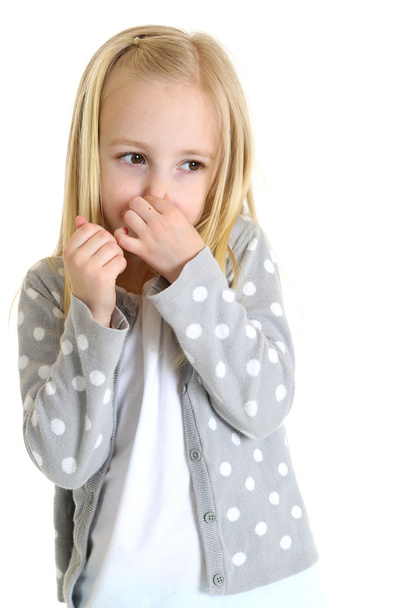 cute young girl holding her nose bad smell - Fotó, kép