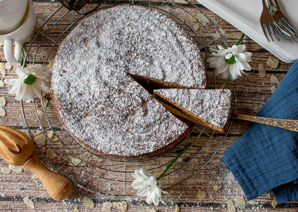 gluten free almond cake from spain served on rustic wooden table background isolated from above - Photo, Image