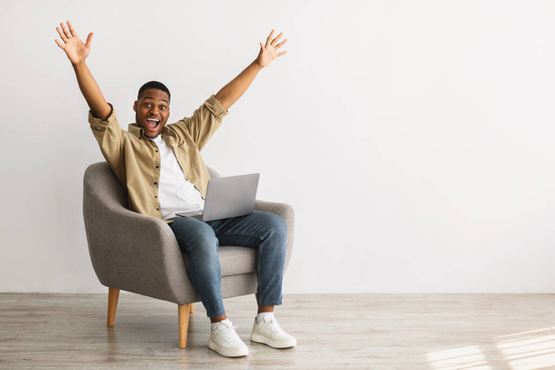 Black Man With Laptop Raising Hands In Joy, Gray Background - Photo, Image