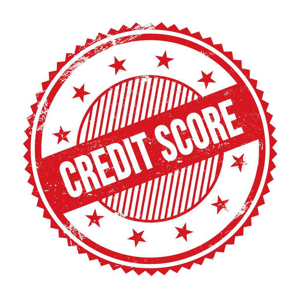 CREDIT SCORE text written on red grungy zig zag borders round stamp. - Photo, Image