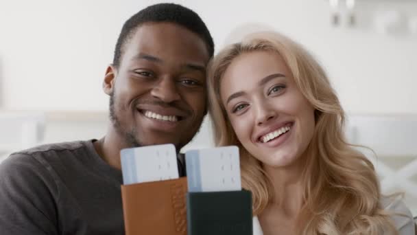 Happy Multiethnic Couple Showing Travel Tickets And Passports Posing Indoors - Footage, Video