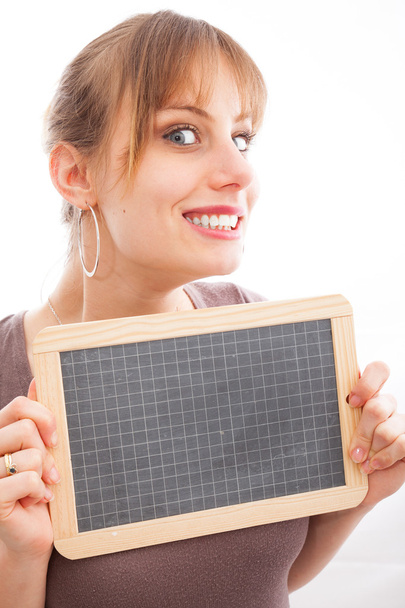 Happy young woman with small blackboard - Foto, afbeelding