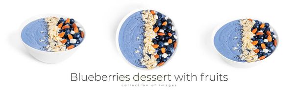 Blueberries dessert with fruits, almond and chia seeds isolated on a white background. Blue smoothie bowl with berries. - Photo, Image