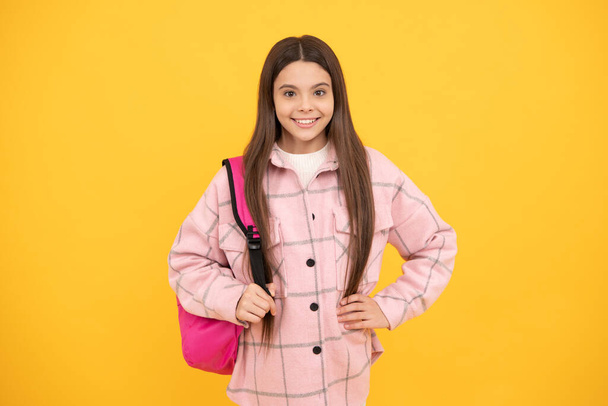 happy kid girl wear pink checkered shirt carry school backpack, childhood. - Photo, Image