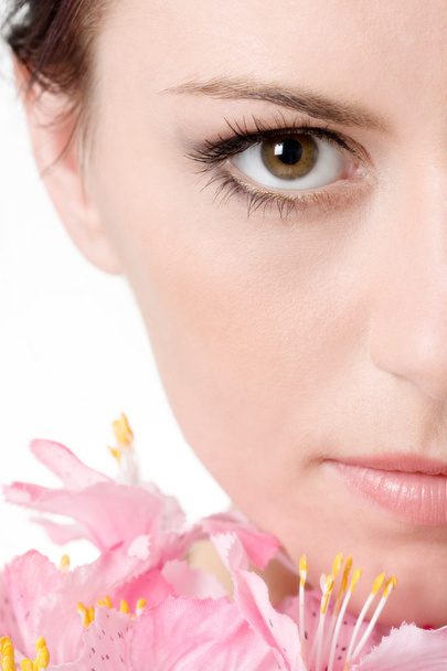 Half of the face of beautiful girl with flower - 写真・画像