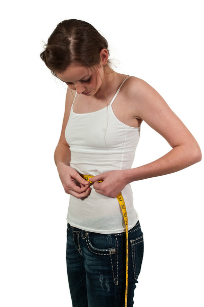 Женщина измеряет талию - Фото, изображение