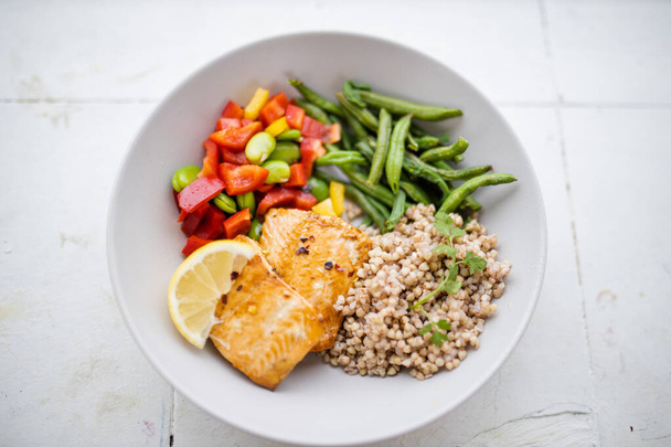 Salmon and buckwheat dish with green beans and tomato - Photo, Image