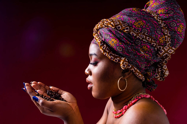 beautiful africa-american woman with turban ower the head in studio - Foto, Bild