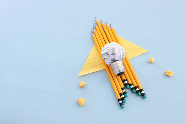 Back to school or education concept. rocket made from pencils over blue background - Fotó, kép