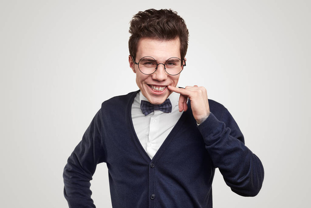 Funny smiling nerdy man in elegant outfit and glasses - Photo, Image