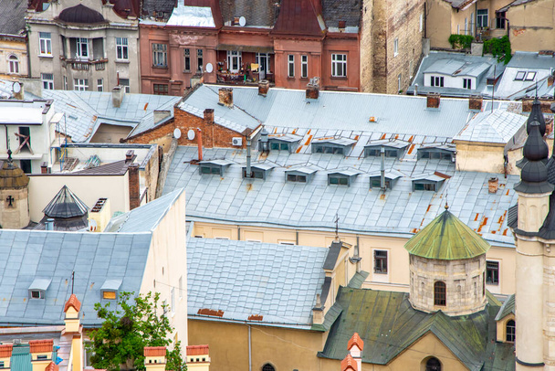 Texture of urban old roofs of a European city, top view. - Fotó, kép