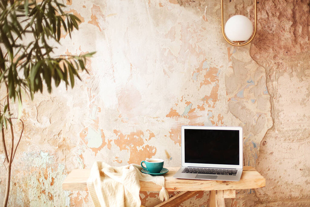 Photo camera and coffee near laptop in creative studio - Photo, Image