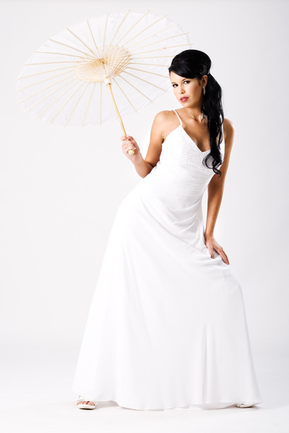 Young beautiful bride with white umbrella - Фото, зображення