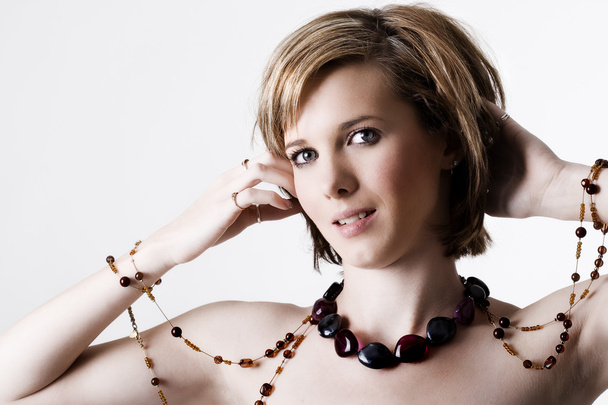 Young female wearing jewelery - Foto, Imagem