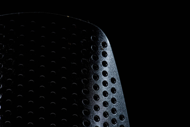 Closeup of a kitchen utensil with small holes. - Foto, Bild