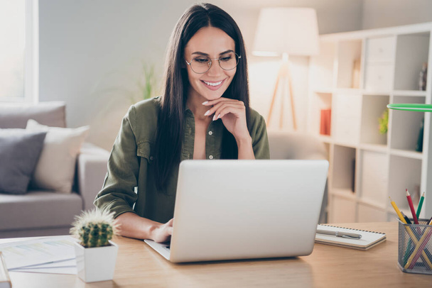 Portrait of charming successful cheerful focused girl working remotely creating finance it presentation report at home house flat indoor - Fotoğraf, Görsel