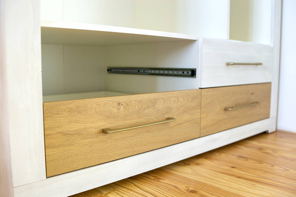 Close up of wooden drawer in contemporary cupboard cabinet. - Foto, Imagen