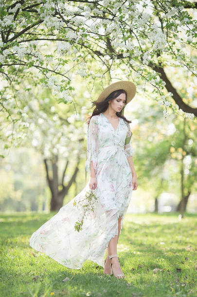 Elegant fashion girl in the garden - 写真・画像