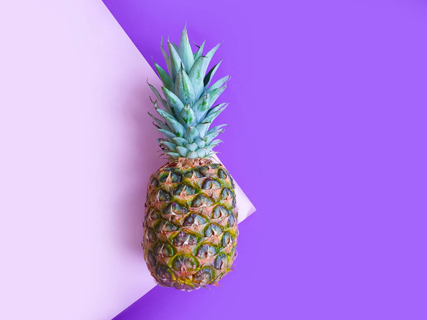 whole pineapple on a colored background - Foto, Imagen