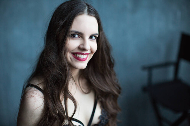Attractive smiling woman in black lingerie. Beauty and fashion. - Fotografie, Obrázek