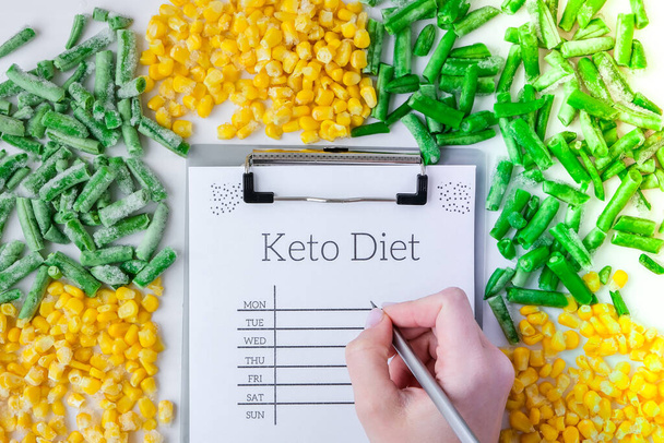 Keto DIET plan. Frozen vegetables food of yellow corn, green beans. Harvest Food preservation for winter. Veganism, vegetarian healthy eating, Empty copy space for text - Photo, Image