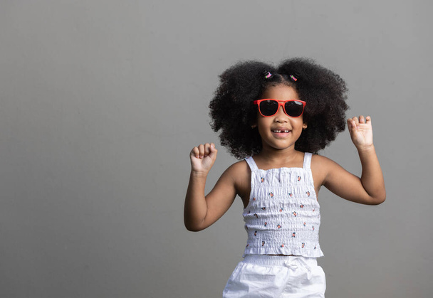 Portrait of African American curly hair girl dancing - Photo, image