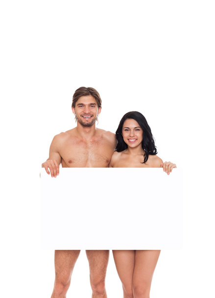 Couple in swimsuits showing blank board - Фото, зображення