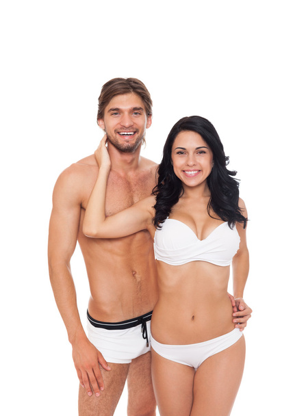 Smiling couple in swimsuits embracing - Foto, Imagem