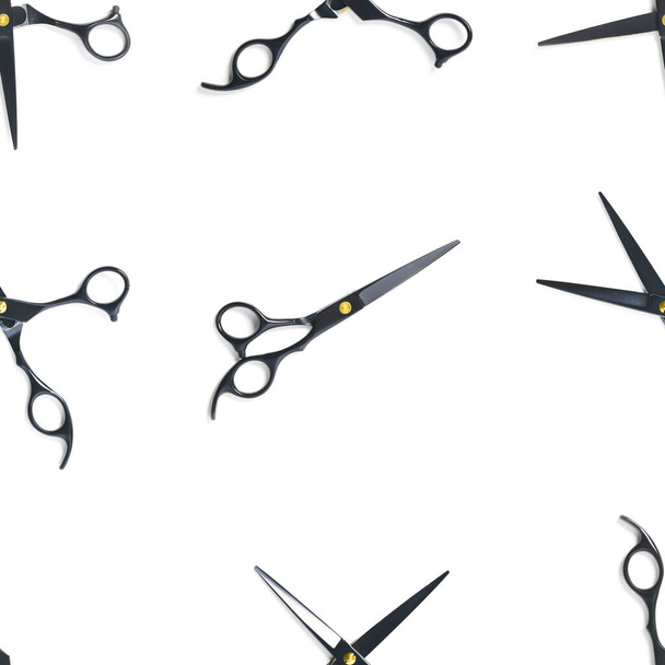 Seamless pattern of black scissors. professional hairdresser black scissors isolated on white. Black barber scissors, close up. pop art background - Photo, Image