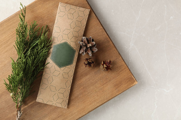 Scented sachet, pine cones and fir branch on grey table, top view - Fotoğraf, Görsel