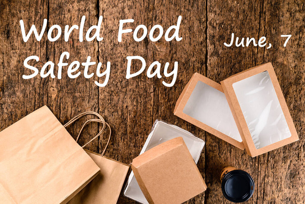 Welttag der Lebensmittelsicherheit - 7. Juni, Eco-Craft Paper Food Containers, Delivery Box, Draufsicht und flaches Lagekonzept von Lebensmittelkraftpapierverpackungen für die Lebensmittellieferung. Papierboxen aus umweltfreundlichen Materialien - Foto, Bild