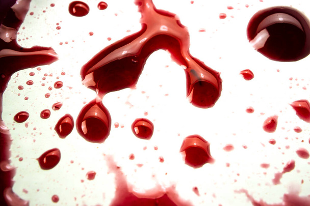 Marmeládové skvrny na hřbetě jako krev. Makro fotografie detailů sladkých kapek - Fotografie, Obrázek