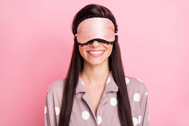 Photo of childish adorable young lady nightwear mask cover eyes isolated pink color background - Photo, image