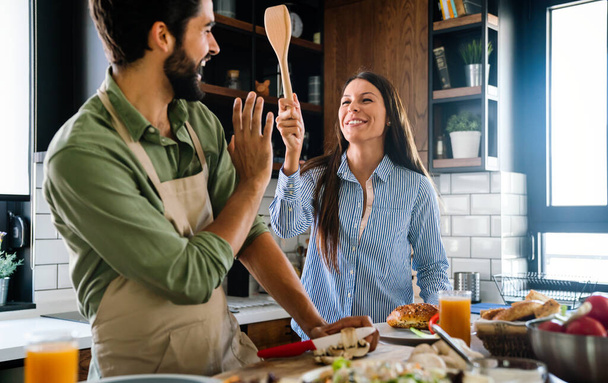 Couple cooking food love happiness hobby liefstyle concept - Foto, Bild