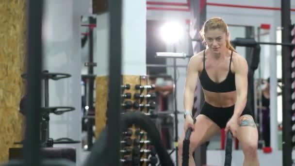 Young woman doing some crossfit exercises with a rope . - Footage, Video