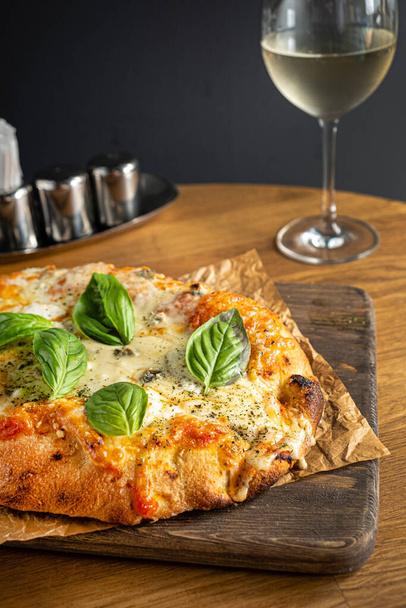 italian pizza on the wooden table - Fotó, kép