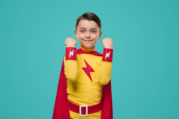 Happy superhero kid celebrating victory - Фото, изображение