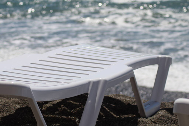 white sun beds on the sea beach - Photo, Image