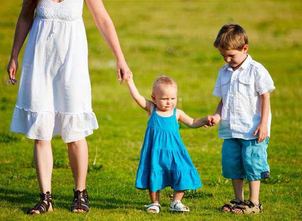 Mother and two kids having fun outdoors at sunny summer day - Foto, Imagem