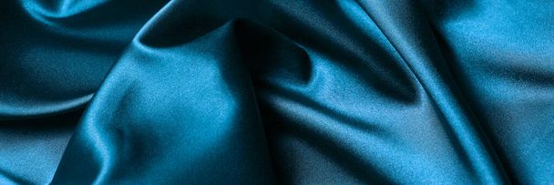 Abstract background luxury cloth or liquid wave or wavy folds of silk texture satin material. Blue background for banner design. - Photo, image