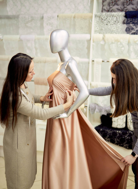 Professional tailors or designers working with mannequin - Valokuva, kuva