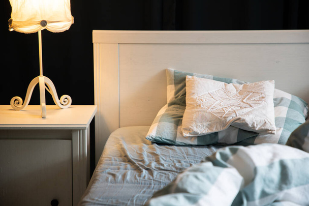 cozy bedroom detail with night lamp - Фото, изображение