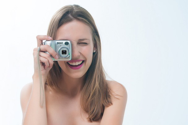 Beautiful woman in bikini making photo on the camera - Foto, Imagen