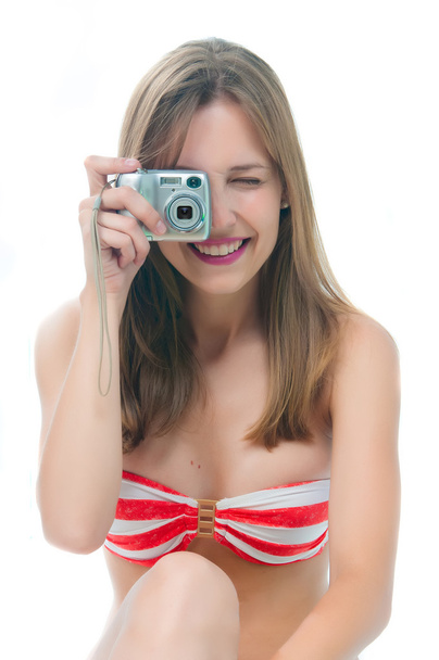 Beautiful woman in bikini making photo on the camera - Foto, imagen
