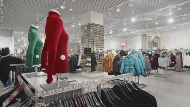 No people overview of indoor women clothing store with outwear and other stylish items - Footage, Video