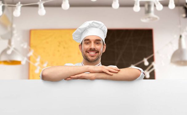 happy smiling male chef with big white board - Фото, изображение