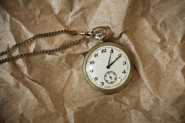 Vintage watch with chain on vintage background - Photo, Image