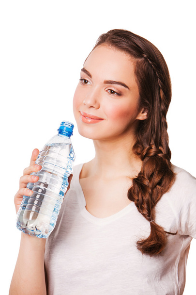 Beautiful woman holding bottle of water. on a diet - Photo, Image
