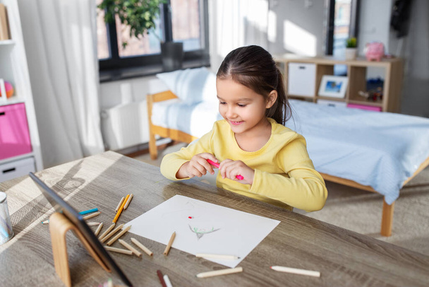 little girl drawing with coloring pencils at home - Valokuva, kuva